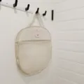 Mesh hanging storage bag detail showing breathable white mesh and cute pink rabbit embroidery. - Rabbit