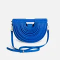 Blue semi-circular crossbody handbag with unique tubular pleated design and chic metal hardware. - Blue