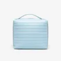 Light blue ribbed cosmetic bag, stylish travel makeup storage case with a convenient top handle. - Light Blue