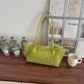 Detailed view of the retro woven shoulder bag, showcasing premium texture and green finish. - Olive Green