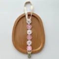 Cute floral baby pacifier clip with white and pink daisy embroidery, anti-lost strap for infants. - Pink White