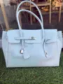 Light blue PVC jelly tote bag, large capacity shoulder handbag with classic lock and flap design. - Icy Blue Medium