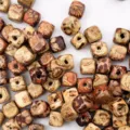 Detailed close-up of mixed color printed square wooden beads, 8mm loose beads for DIY jewelry. - 100 Pieces/Pack / Multicolor