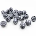 Close-up details of 16mm striped wooden beads featuring center holes for handmade DIY crafts. - Gray Background with White Stripes