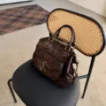 Vintage oil wax leather motorcycle tote bag with double front pockets and chic hardware styling. - Brown