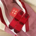 Red winter long socks for women, festive fuzzy Chinese character pattern, cozy knit fabric detail. - Get Rich (Red)