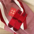 Red mid-tube socks for women, comfortable cotton knit fabric with festive flocked details. - As Desired (Red)