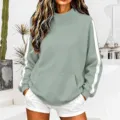 Stylish women mock neck ribbed sweatshirt featuring casual side stripes and front pocket details. - Light Green