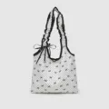 Sac à bandoulière en toile à pois doux de style coréen avec nœuds noirs et volants vue principale - Sac Blanc