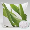 Waterproof pillowcase detail showing green leaf print and fabric waterproof droplet test close-up. - 90g Waterproof Polyester Fabric 45x45cm Single-Sided Print (Without Core) / Green Leaf Water Drop Style