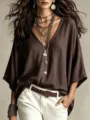 Detailed close-up view of a stylish women's V-neck loose casual t-shirt, autumn fashion top. - XS / Coffee