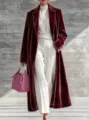 Velvet long coat detail view, showing the premium texture, lapel design, and elegant winter fashion. - Burgundy