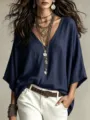 Close-up detail of women casual solid V-neck loose autumn top showing fabric and necklace. - XS / Navy Blue
