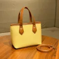 Sac seau élégant en cuir synthétique jaune et marron avec anses et bandoulière amovible. - Sac Jaune Millet (Sans Pendentif)