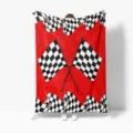 Close-up detail of the racing checkered flannel blanket, showcasing cozy red fabric. - M20260818-4