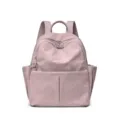 Stylish women's casual backpack in dusty pink, spacious daily travel and school book bag. - Pink