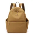Washable nylon backpack for women, casual travel school book bag in khaki, front pocket. - Turmeric