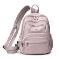Women multi-pocket casual waterproof nylon backpack versatile commuting student bag main view - Pink