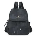 Stylish women's dark denim textured backpack with flap and drawstring closure for daily use. - Black