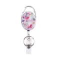 Retractable badge reel with oval floral pattern metal carabiner and clear ID card holder. - Pink