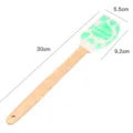 Wooden handle silicone spatula with leaf pattern for baking cakes, cream, and kitchen use. - Leaf