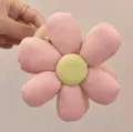 Close-up detail of a pink fabric flower hair claw clip with yellow center, elegant style. - Light Pink