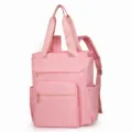 Pink nylon backpack for women, multi-functional travel bag with shoulder straps and top handles. - Pink