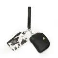 Stylish two-in-one women wrist bag featuring cow print cardholder and black coin purse. - Black Cow Print