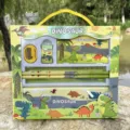 Close-up view of the dinosaur stationery set gift box, showing pencils, ruler and case details. - Dinosaur