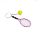 Cute pink tennis racket keychain with mini ball charm, perfect sports gift and accessory. - Purple