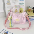 Pink gingham crossbody bag with adjustable strap and cute pendant for daily casual commuting style - Pink with Moon Pendant