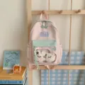 Rosa und mintfarbener Schulrucksack mit süßer transparenter Fronttasche und Plüschanhängern. - Mit Anhänger / S / Rosa