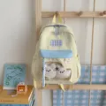 Farbfroher Schüler-Rucksack mit klarem Sichtfenster und süßen Plüschtieren für Schule. - Mit Anhänger / S / Gelb