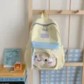 Sommerlicher frischer Schüler-Rucksack im Farbblock-Design mit transparenter Fronttasche. - Mit Anhänger / L / Gelb