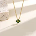 Detailed close-up shot of gold-plated green clover pendant necklace, elegant clavicle jewelry. - Necklace / Gold with Green Zirconia