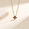 Elegant gold stainless steel four leaf clover red gemstone pendant necklace for women. - Necklace / Gold with Red Rhinestones