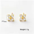 Exquisite gold clover stud earrings with sparkling zircon stones, measuring 7x7mm for daily wear. - Stud Earrings / Gold