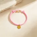 Pink braided leather bracelet with gold round pendant and beads for women fashion jewelry. - Pink Cord Gold Tone
