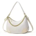 Detailed view of the chic white croc-embossed underarm shoulder bag with gold chain accent. - White