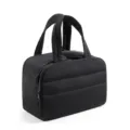 Black quilted travel makeup bag with handles and smooth dual zippers for cosmetic storage. - Black
