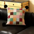 Colorful geometric patchwork throw pillow with black pom-poms for modern sofa home decor. - Colorful Moon Black Pom-Pom