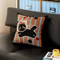 Detailed view of cute black cat pattern cushion pillow on modern black leather sofa living room. - Milk Cat Stripes