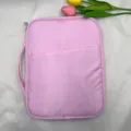 Pink tablet sleeve bag with handle and front pocket for portable daily protection and business use. - Pink