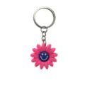 Llavero de margarita rosa con smiley azul, bonito colgante de bolso de dibujos y anilla metálica. - 006-24 Llavero