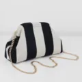 Black and white striped knitted clutch bag with gold chain strap, stylish detail view. - Thick Striped / Black and Cream Stripe