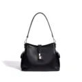 Black genuine leather shoulder bag with metal lock closure and side pockets for daily use. - Black