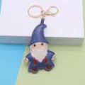 Cute leather gnome keychain bag pendant, cartoon dwarf keyring charm for holiday decor. - Christmas Style / Gold Buckle Santa Claus