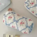 Quilted cosmetic pouch with blue bow and pink rose print, stylish minimalist storage bag. - Blue Butterfly