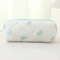 Quilted cosmetic pencil pouch, blue bow print fabric storage bag, minimalist style. - White with Blue Butterfly