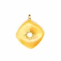 Closeup detail shot of diamond shaped crystal gemstone pendant with golden star mount. - Topaz